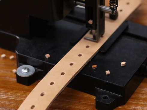 Oval hole punching machine